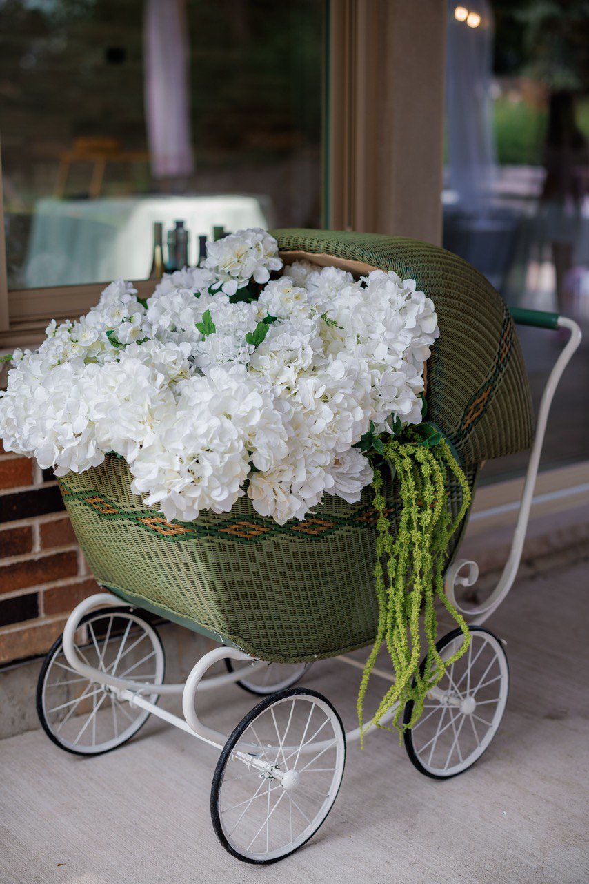 Flamingo pool party table with tropical leaves, papaya centerpiece and pink place settings by the pool