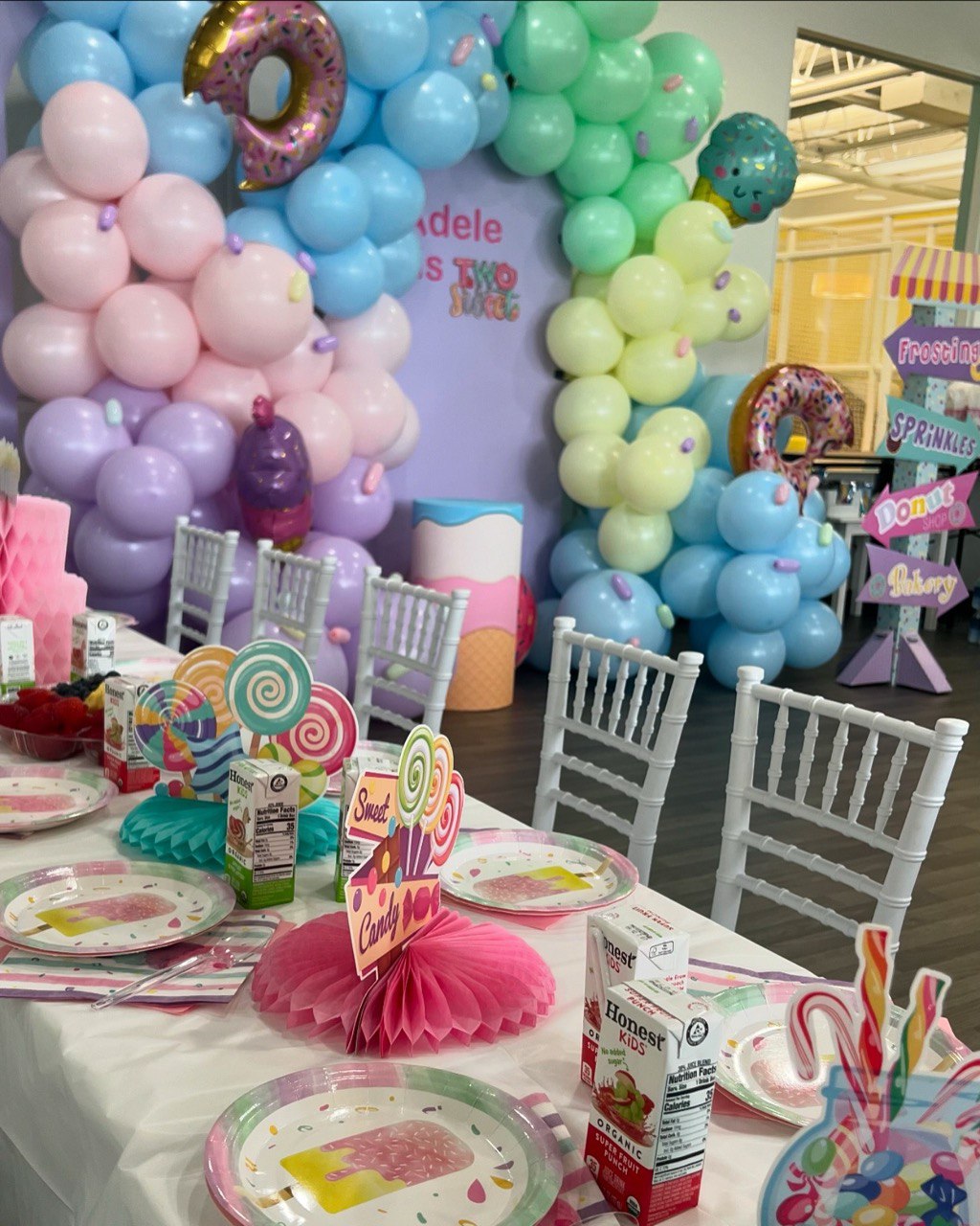 Soccer birthday backdrop with oversized jersey and balloon garland decoration