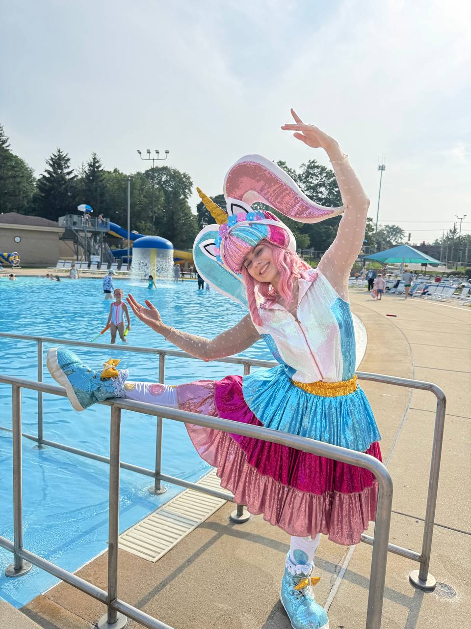 Unicorn character entertainer performing at a kids pool party