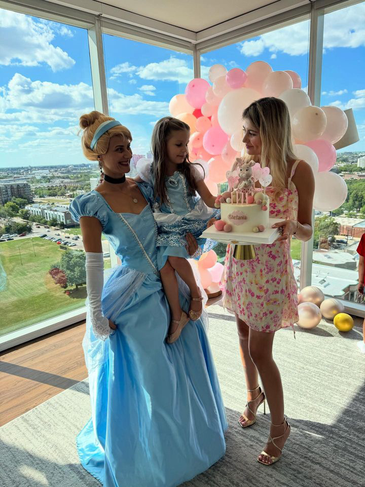 Cinderella entertainer with a mom and child holding a birthday cake