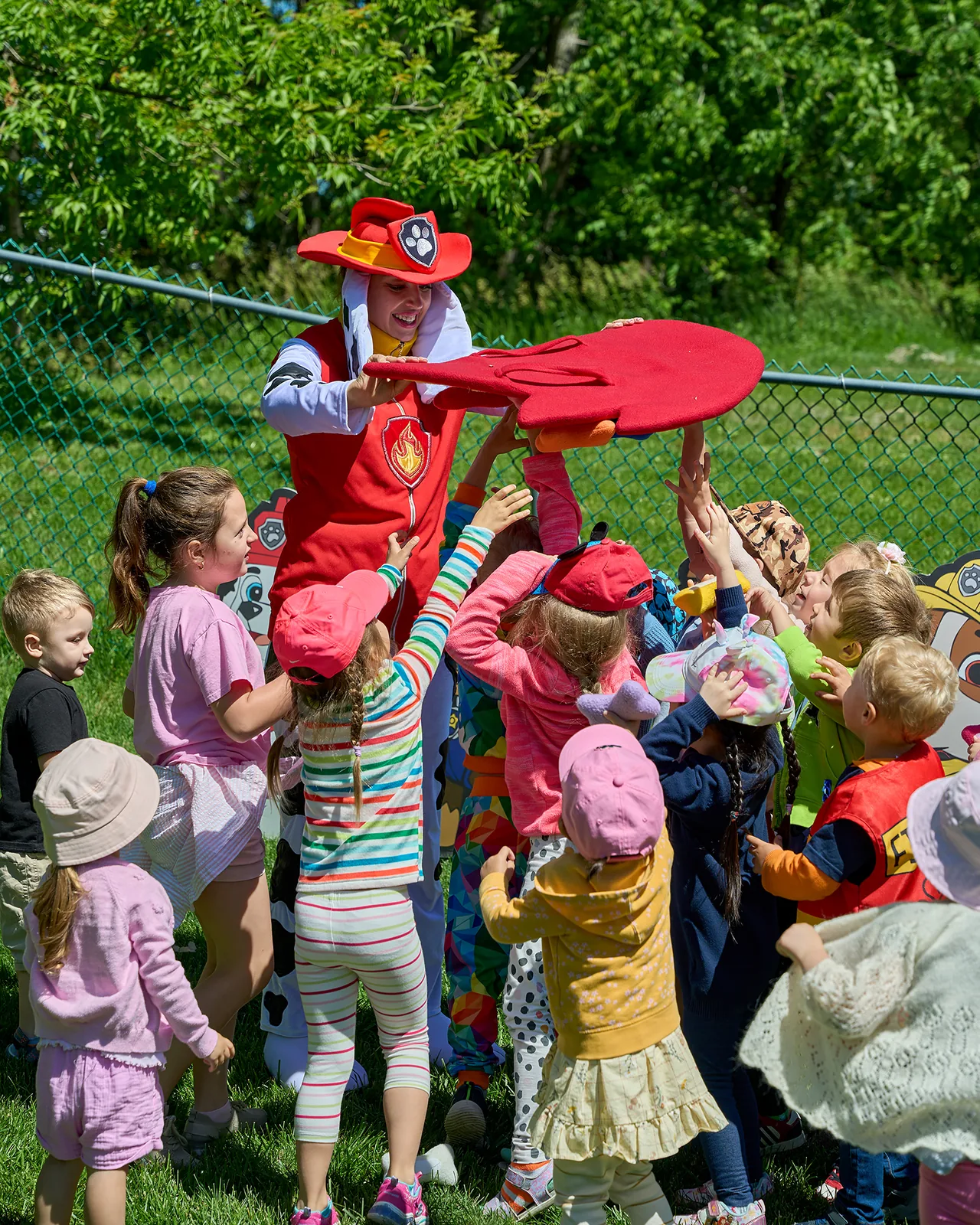 Paw Patrol Marshall entertainer running group games for children's birthday party in the Chicago suburbs