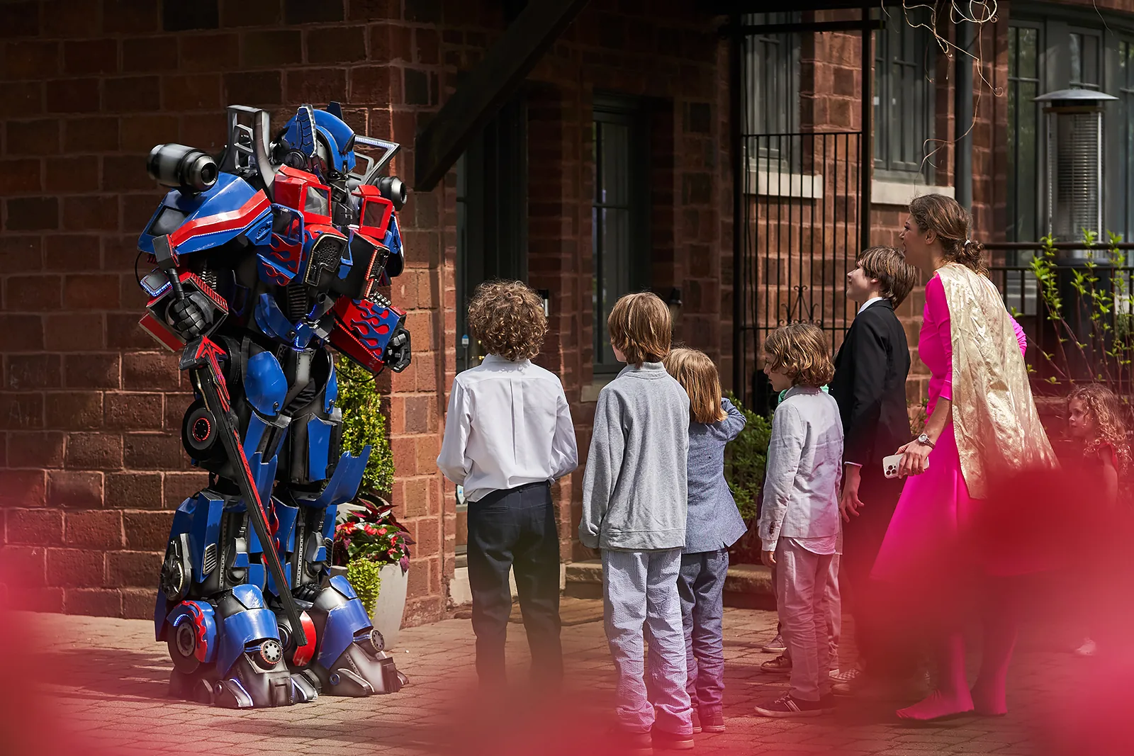 Prime meeting kids and Supergirl at children's party event