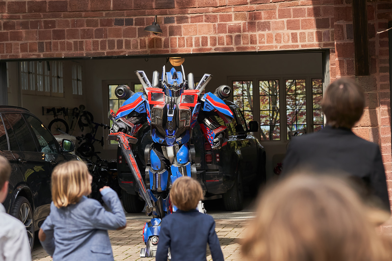 Optimus Prime robot character arriving at a kids' party in Chicago suburbs
