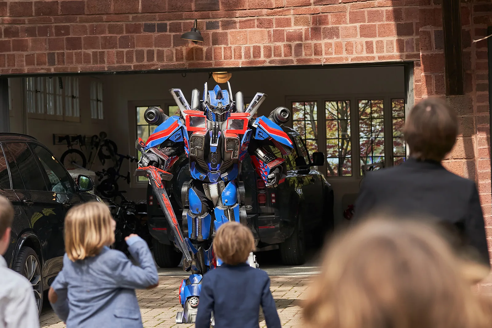 Optimus Prime robot character arriving at a kids' party in Chicago suburbs