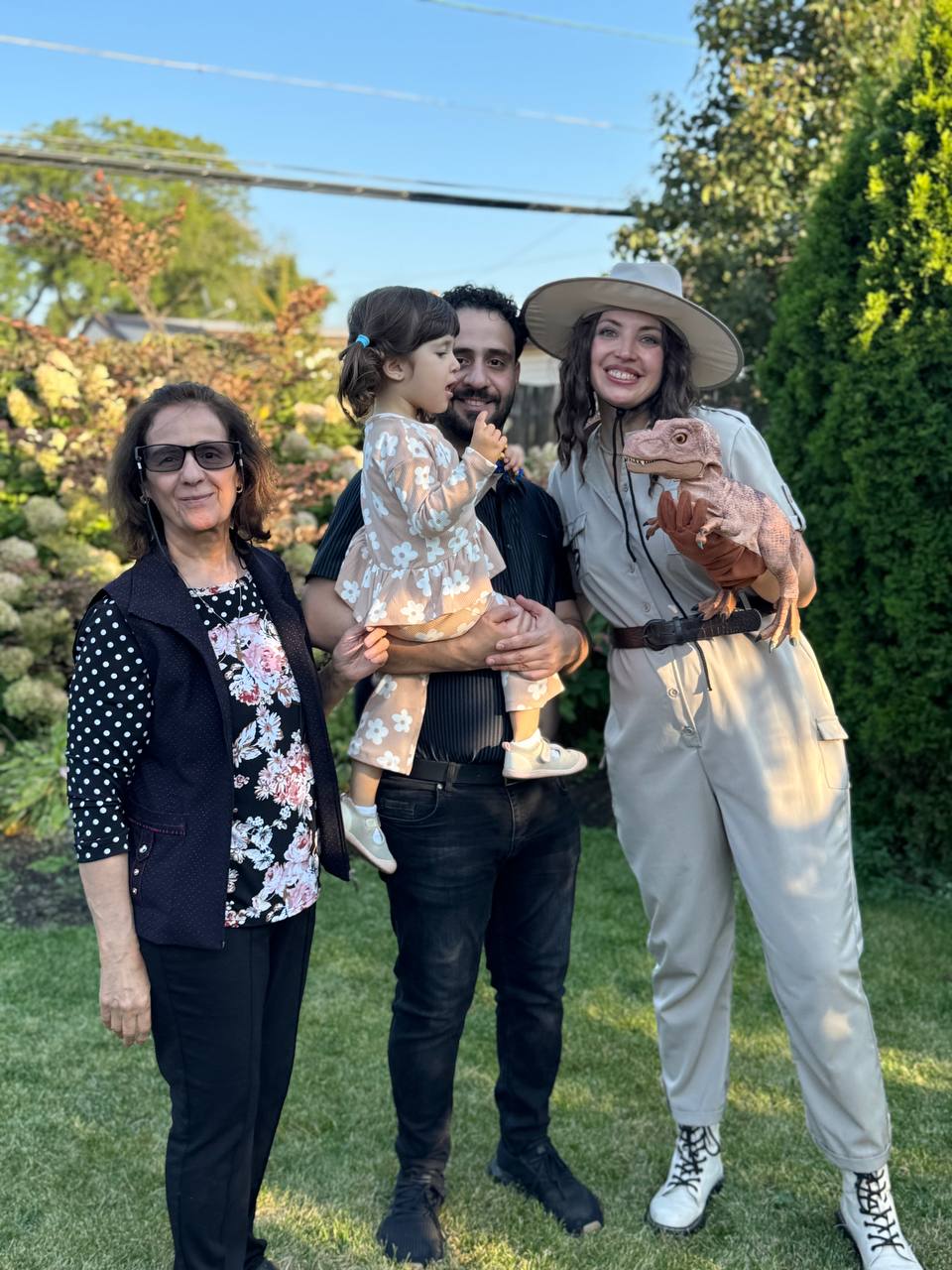 Children gathered around a performer dressed as a safari guide at a party